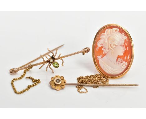 FOUR ITEMS OF JEWELLERY, to include an early 20th century 9ct gold spider bar brooch, collet set with a peridot and a seed pe