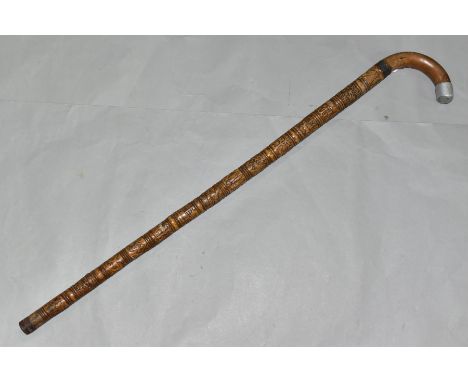 A SECOND WORLD WAR INTEREST WALKING STICK, the handle with aluminium tip, late Victorian hallmarked silver band, Birmingham 1