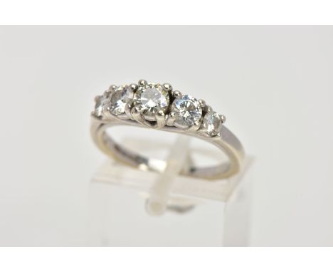 A 9CT WHITE GOLD FIVE STONE RING, designed with a row of five graduated, circular cut, colourless stones, assessed as moissan