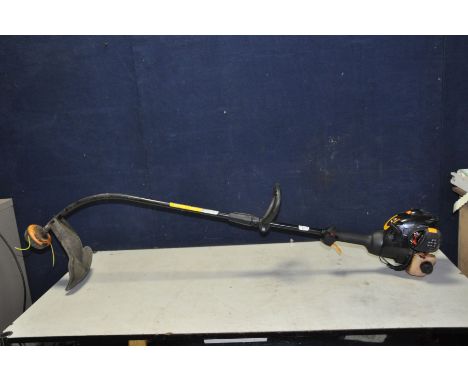 A McCULLOCK TRIMAC PETROL STRIMMER (engine pulls freely but hasn't been started)