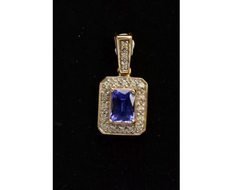 AN 18CT GOLD TANZANITE AND DIAMOND PENDANT, of a rectangular form, designed with a four claw set, rectangular cut tanzanite, 