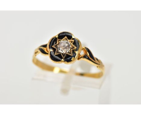 A VICTORIAN, DIAMOND AND BLACK ENAMEL MEMORIAL RING, centring on a star set, old cut diamond within a black enamelled flower 