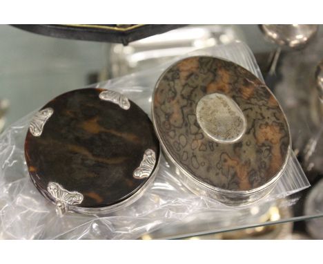 A Georgian tortoiseshell and silver oval snuff box and a silver and tortoiseshell folding magnifying glass.