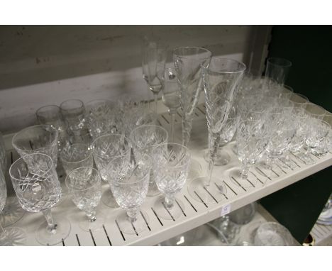 A shelf of cut glass drinking glasses.