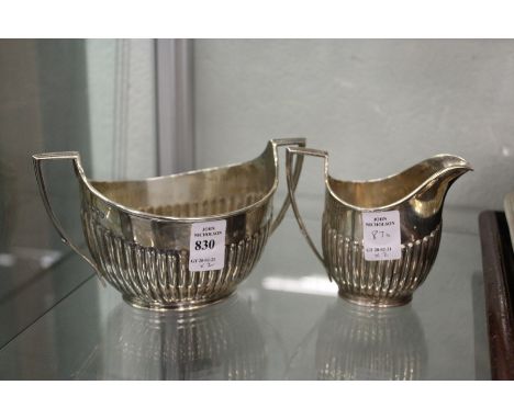 A Victorian silver half fluted sugar basin and milk jug, London 1893, 13ozs.