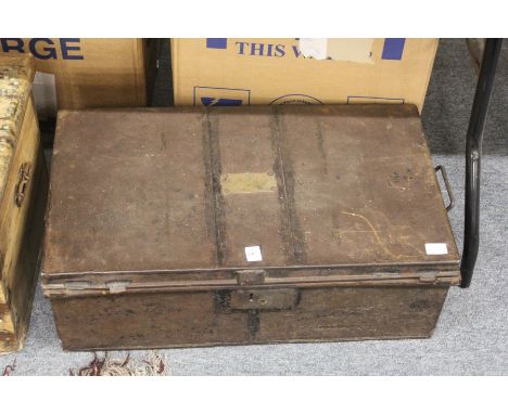 A black japanned tin trunk with engraved name plate.