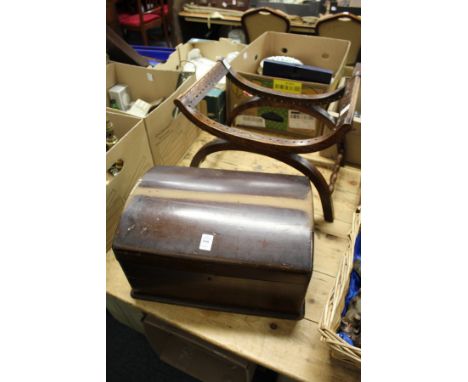A small dome top trunk and a stool frame.