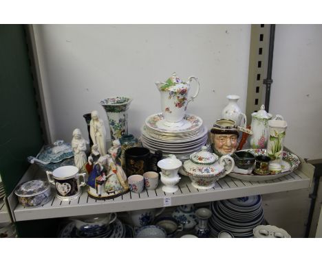 A shelf of decorative china.