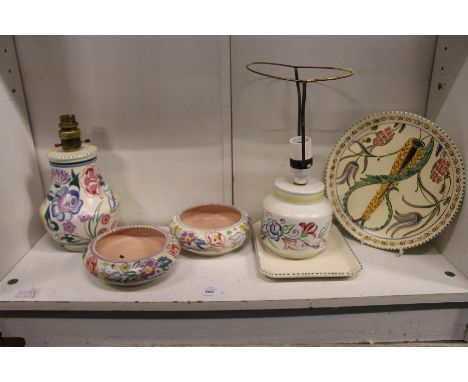 A quantity of Poole pottery and similar china to include lamp bases and bowls.