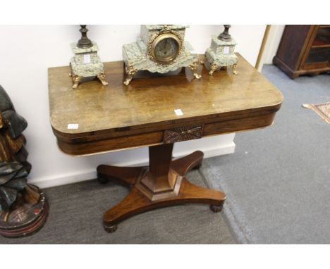 A 19th century rosewood D-shaped foldover card table.