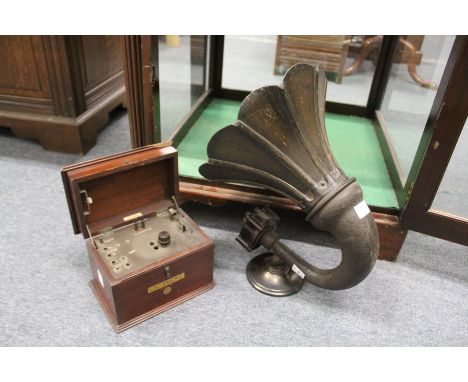 An Amplion plywood and Bakelite horn shaped speaker together with a BBC Gecophone.