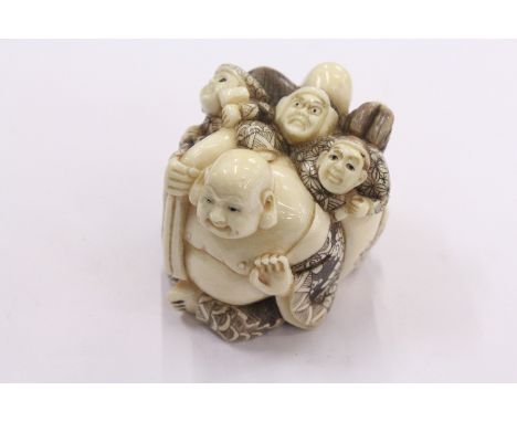 A Chinese large carved ivory netsuke.