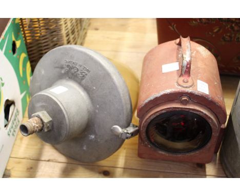 An old GEC exterior light and a hand lantern.
