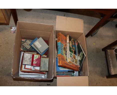 Two boxes containing various vintage games, jigsaw puzzles etc.