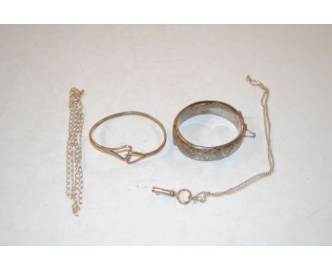A silver snap bangle, silver bangle with stylised heart shaped design, a silver key pendant hung to fine link chain, and a 92