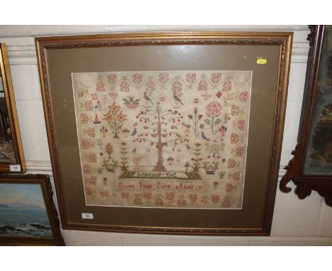 An antique sampler depicting Adam and Eve worked by Susan Jane Luce Aged 11