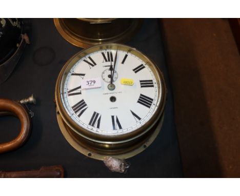 A James Gent & Son of London brass cased ships clock (enamel dial AF)