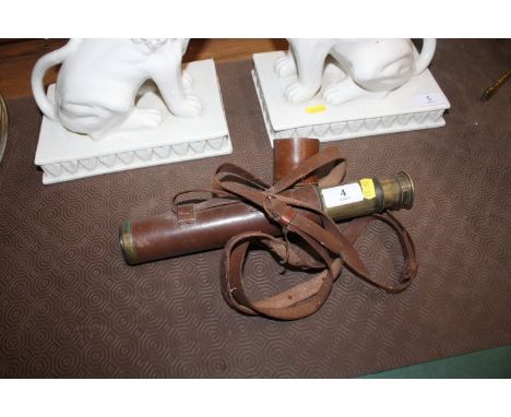 A small brass and leather bound telescope 