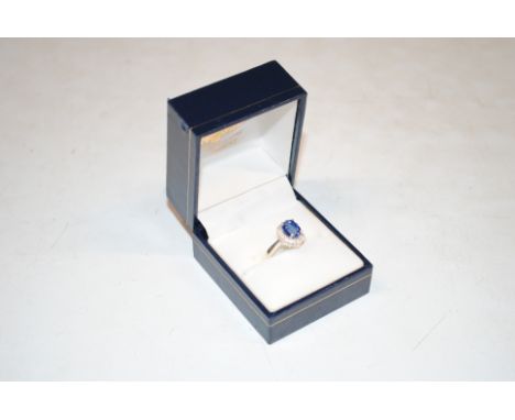 A Sterling silver, diamond and Nilamani halo ring, ring size J/K