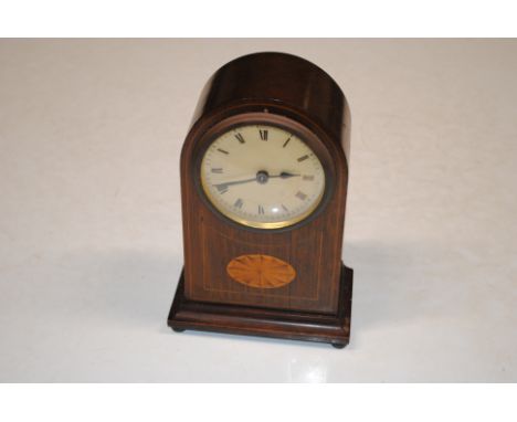 An Edwardian mahogany and inlaid cased mantel clock with key 