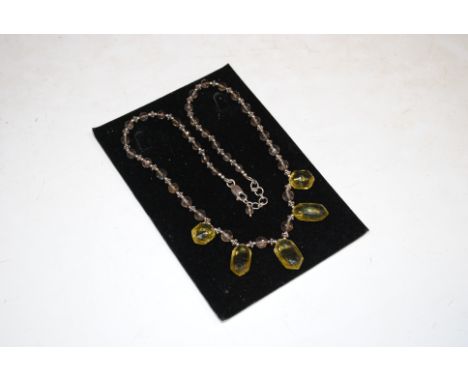 A vintage sterling silver and smoky quartz and peridot necklace 