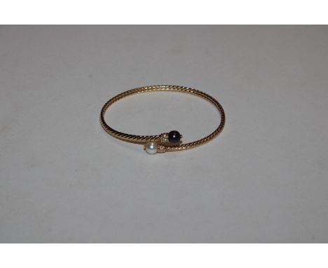 A 18ct gold pearl and diamond set bangle, 7gms total weight