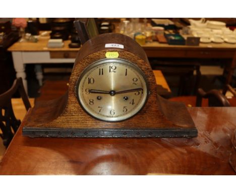 An oak two hole mantel clock