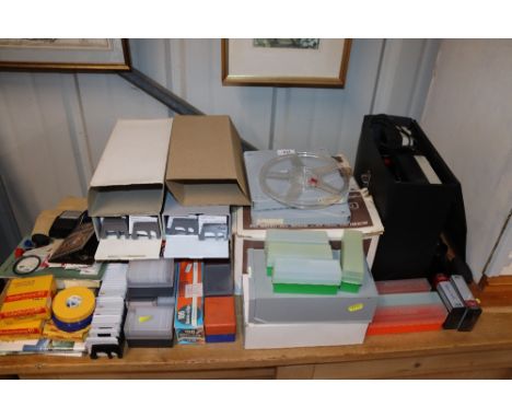 A slide projector and a quantity of various slides 