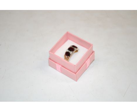 A vintage silver gilt and garnet set ring, ring size S/T