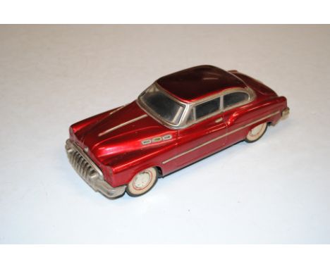 A tin plate model of a vintage car