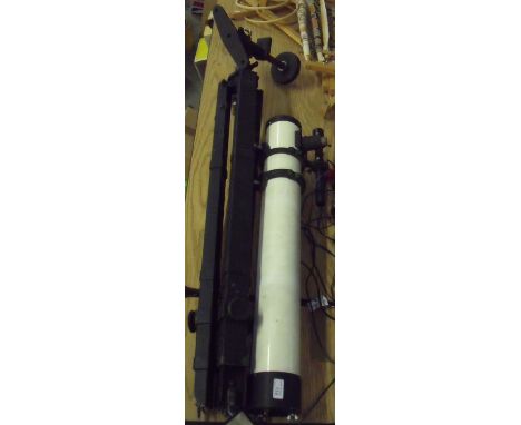 Large telescope on tripod stand