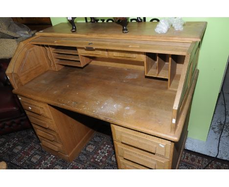 Large joiner made light oak roll top desk with fitted interior on two raised pedestals of six drawers 