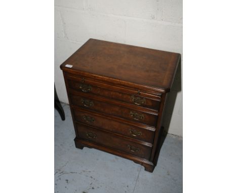 Quality burr walnut effect reproduction bachelors chest of drawers of small proportions with slide above four short drawers o