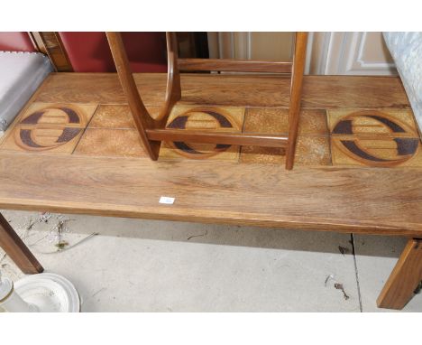 A Trioch retro rectangular coffee table with inset tile panels, stencilled underneath 'Made in Denmark 79'