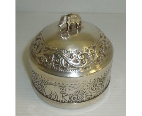 Circular white metal tea caddy with elephant finial and and engraved detail and stamped teapot mark to base Tea Jang