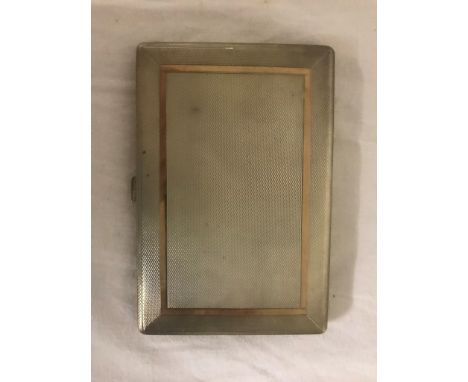 A silver and gold cigarette case by Walker & Hall
