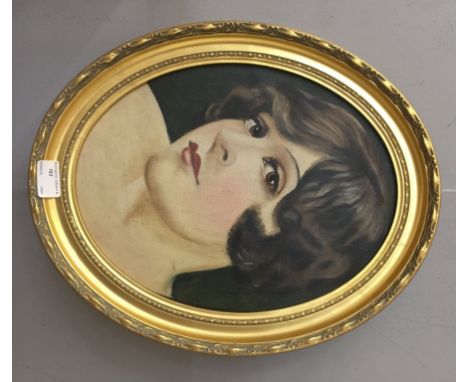 An Art Deco-style portrait of a lady, oil on canvas laid on board, 35 x 26 cm