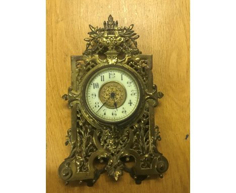 A brass mantel clock
