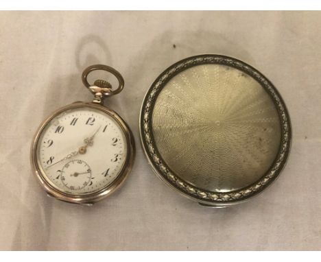 A silver compact; together with a pocket watch