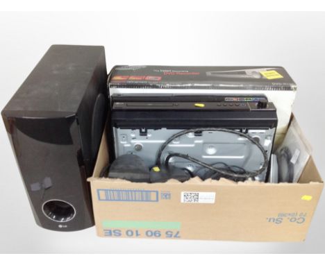 A box containing Samsung DVD recorders, a pair of LG speakers, Bose speaker.