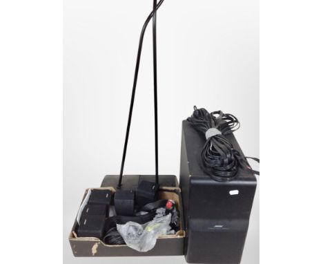 A group of Bose speakers, cables, pair of speaker stands.