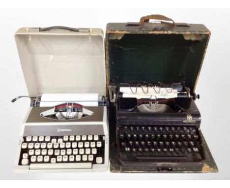 A vintage Olympia typewriter with one other.