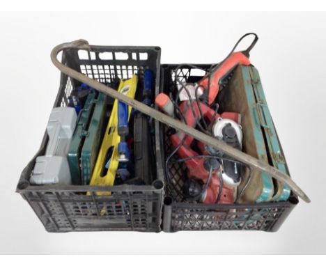 Two crates containing power and hand tools, including Einhell planer, angle grinder, spirit level, crowbar, etc.