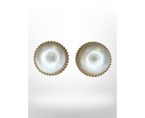 A pair of mabe pearl earrings mounted in 9ct yellow gold, each diameter 9.34 mm.