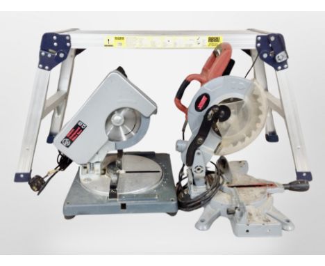 A collapsible aluminium work bench, and two circular mitre saws.