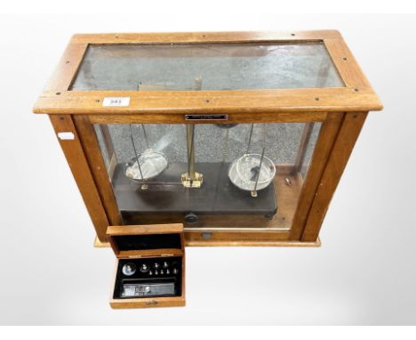 A set of Griffin and George chemist's scales in glazed box, width 50cm.