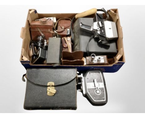 A group of vintage cameras and handheld video cameras including Bolex, Bell and Howel, etc.