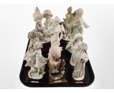 A group of G Armani Italian figures, with further lamp base.