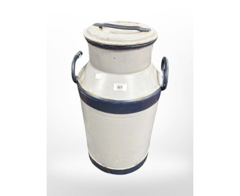 A painted metal milk churn, height 58cm.