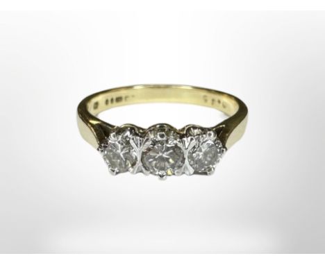 An 18ct gold three stone diamond ring, size  CONDITION REPORT: 3.6g